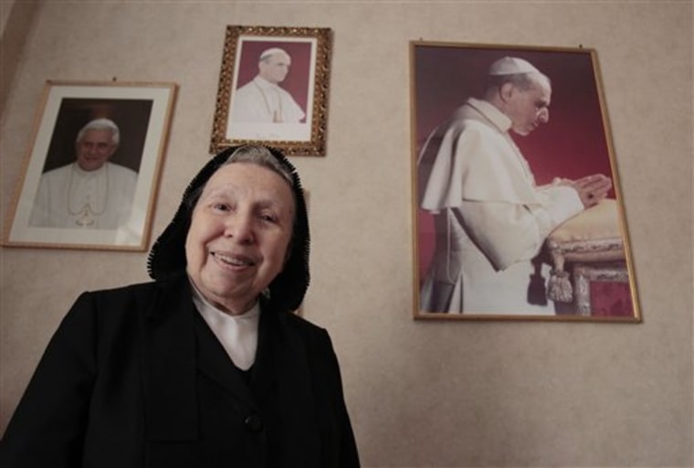 In this photo taken in Rome on  May 31, 2011 sister Margherita Marchione smiles near portraits of Pope Pius XII, right, Paul VI, center, and Pope Benedict XVI, left, during an interview with the Associated Press. \"It annoys me terribly that such an injustice is being done to such a great man, that he should be treated the way he is,\" said Sister Margherita Marchione, the 89-year-old American nun of Italian heritage who is Pius' main biographer. Sitting in her order's convent a stone's throw from the Vatican, Marchione said her religious congregation alone, on orders from Pius, sheltered 114 Jewish women at three separate convents during the Nazi occupation. \"I'm just tired of the whole thing that people can't go back to the documents that prove it and accept it as historical truth,\" she said in a recent interview. Marchione flips through one of her nine books on Pius to prove her point: a photo of Jewish women and children sheltered in the papal summer residence at Castel Gandolfo; a photo
